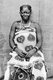 Tanzania / Zanzibar: Swahili woman posing in kanga wrap-around dress, late 19th-early 20th century