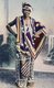 Tanzania / Zanzibar: 'A Zanzibar Beauty' dressed in her resplendent best, c. 1910